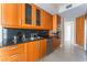 Well-equipped kitchen with sleek appliances, custom wood cabinetry, and elegant countertops at 2877 Paradise Rd # 1806, Las Vegas, NV 89109