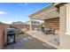 Backyard patio with grill, hot tub, and dining and lounge furniture under a pergola at 2924 Duverney Ave, Henderson, NV 89044