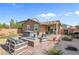 Serene backyard oasis with a hot tub, fire pit, and comfortable lounge furniture at 2924 Duverney Ave, Henderson, NV 89044