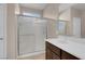 Bright bathroom with a glass-enclosed shower and a white countertop at 2924 Duverney Ave, Henderson, NV 89044