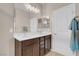Bathroom featuring double sinks and a large mirror, providing ample space at 2924 Duverney Ave, Henderson, NV 89044