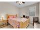 Comfortable bedroom features a wooden bed frame and a ceiling fan at 2924 Duverney Ave, Henderson, NV 89044