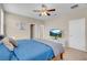 Bedroom featuring a bed, TV, and access to a walk-in closet and en-suite bathroom at 2924 Duverney Ave, Henderson, NV 89044