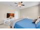Well-lit bedroom with a ceiling fan and modern furnishings at 2924 Duverney Ave, Henderson, NV 89044