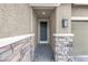 Close-up view of the front door and stone pillar detail creates an inviting entrance at 2924 Duverney Ave, Henderson, NV 89044