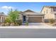 Charming single-story home with a well-manicured lawn and a two-car garage in a quiet neighborhood at 2924 Duverney Ave, Henderson, NV 89044