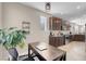 Modern kitchen adjacent to an office space, featuring stainless steel appliances and sleek countertops at 2924 Duverney Ave, Henderson, NV 89044