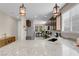 Open kitchen with granite countertops, stainless steel appliances, and a view to the dining area at 2924 Duverney Ave, Henderson, NV 89044
