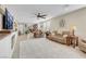 Bright and airy living room featuring an open layout, stylish furnishings, and seamless access to the dining area at 2924 Duverney Ave, Henderson, NV 89044