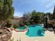 Inviting backyard pool and spa with lush landscaping and private patio area at 2986 Matese Dr, Henderson, NV 89052