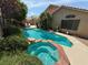 Inviting backyard pool and spa with lush landscaping and private patio area at 2986 Matese Dr, Henderson, NV 89052