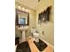 This bathroom offers a pedestal sink, toilet, and unique decor, adding character to the space at 2986 Matese Dr, Henderson, NV 89052