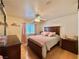Cozy bedroom with a queen-sized bed, soft pink accents, and bright natural light at 2986 Matese Dr, Henderson, NV 89052