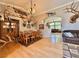 Inviting dining room with a spacious wooden table and hardwood floors at 2986 Matese Dr, Henderson, NV 89052