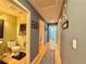 Hallway with hardwood floors leads to bedrooms and bathrooms, showcasing neutral wall colors at 2986 Matese Dr, Henderson, NV 89052
