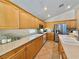 Bright kitchen features wood cabinets, stainless steel appliances, and a neutral countertop at 2986 Matese Dr, Henderson, NV 89052