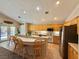 Well-appointed kitchen with stainless steel appliances, a breakfast bar, and ample cabinet space for storage at 2986 Matese Dr, Henderson, NV 89052