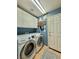 Laundry room featuring a modern washer and dryer set and white cabinets at 2986 Matese Dr, Henderson, NV 89052