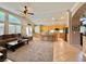 Open-concept living room with a cozy seating area, kitchen island with bar stools, and modern finishes at 2986 Matese Dr, Henderson, NV 89052
