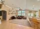 Spacious living room featuring a plush sectional sofa, natural light, and an open layout for easy entertaining at 2986 Matese Dr, Henderson, NV 89052