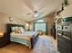 Serene main bedroom with ceiling fan, ensuite bathroom, and large windows at 2986 Matese Dr, Henderson, NV 89052