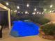 Relaxing backyard pool and spa area illuminated by string lights creating a cozy outdoor ambiance at 2986 Matese Dr, Henderson, NV 89052