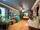 A room with many shelves and decorative items and hardwood floors under a fan at 2986 Matese Dr, Henderson, NV 89052