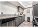 Galley kitchen features updated stainless steel appliances and granite countertops at 3120 S Eastern Ave # 5, Las Vegas, NV 89169