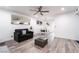 Open-concept living room with neutral tones and an adjacent dining area at 3120 S Eastern Ave # 5, Las Vegas, NV 89169