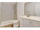 Modern bathroom featuring tiled shower, white vanity, and updated fixtures at 3151 Soaring Gulls Dr # 2002, Las Vegas, NV 89128