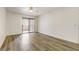 Bedroom with wood-look floors and sliding doors leading to an outdoor balcony at 3151 Soaring Gulls Dr # 2002, Las Vegas, NV 89128
