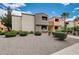 Landscaped condominium exterior featuring neutral tones, architectural details, and manicured grounds at 3151 Soaring Gulls Dr # 2002, Las Vegas, NV 89128
