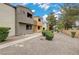 The exterior shows the home's landscaping and private entrances at 3151 Soaring Gulls Dr # 2002, Las Vegas, NV 89128
