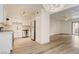 Well-lit kitchen with white cabinets, stainless steel appliances, and wood-look floors at 3151 Soaring Gulls Dr # 2002, Las Vegas, NV 89128
