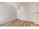 Bright room with wood-look floors and light fixture adjacent to kitchen cabinets at 3151 Soaring Gulls Dr # 2002, Las Vegas, NV 89128