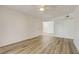 Spacious, sunlit living room with light wood-look floors and fresh paint, ready for personal touches at 3151 Soaring Gulls Dr # 2002, Las Vegas, NV 89128