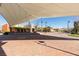 Modern community center with covered outdoor space, brick plaza, manicured landscaping, and stylish architecture at 3166 Via Da Vinci, Henderson, NV 89044