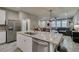 Open concept kitchen featuring a large island with seating overlooking living areas at 3166 Via Da Vinci, Henderson, NV 89044