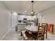 An eat-in kitchen features an island, stainless steel appliances, and white countertops at 3166 Via Da Vinci, Henderson, NV 89044