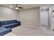 Comfortable living area with a sectional sofa and neutral carpet at 3166 Via Da Vinci, Henderson, NV 89044
