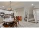 Open concept floor plan of eat-in kitchen adjacent to staircase at 3166 Via Da Vinci, Henderson, NV 89044