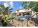 Beautiful backyard boasting outdoor kitchen, manicured plants, and ample seating areas at 3186 Lapis Beach Dr, Las Vegas, NV 89117