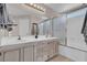 Bright bathroom with double sinks, neutral cabinets, and modern fixtures at 3186 Lapis Beach Dr, Las Vegas, NV 89117