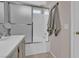 Bathroom showcasing a shower with sliding glass doors and coordinating gray towels at 3186 Lapis Beach Dr, Las Vegas, NV 89117