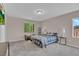 Cozy bedroom with a plaid bedspread and large windows providing natural light at 3186 Lapis Beach Dr, Las Vegas, NV 89117