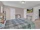 Comfortable bedroom with a TV, carpeted floors, and neutral wall color at 3186 Lapis Beach Dr, Las Vegas, NV 89117