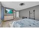 A spacious bedroom with a dresser, TV, and ample space for relaxation at 3186 Lapis Beach Dr, Las Vegas, NV 89117