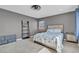 Cozy bedroom with large windows and a comfortable bed, perfect for relaxation at 3186 Lapis Beach Dr, Las Vegas, NV 89117