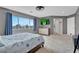 Bedroom featuring large windows, carpet floors, ceiling fan, and ensuite bathroom at 3186 Lapis Beach Dr, Las Vegas, NV 89117