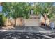 Charming home featuring a two-car garage, drought tolerant landscaping and covered entry at 3186 Lapis Beach Dr, Las Vegas, NV 89117